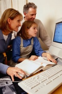 Family around computer Family around computer